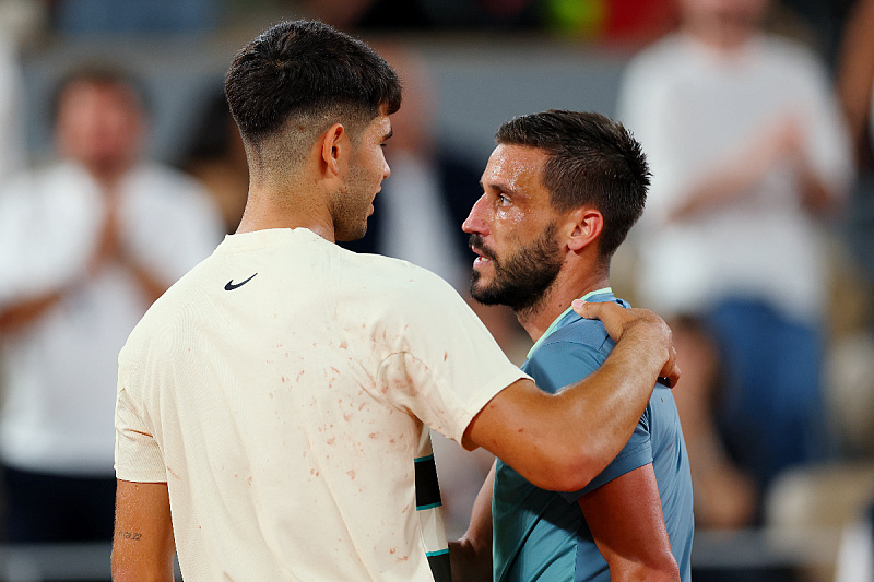 Carlos Alcaraz i Damir Džumhur (Foto: Reuters)