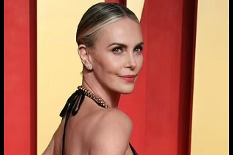 Defying age with her looks: Charlize Theron (50) shows off a perfect figure in a yellow bikini