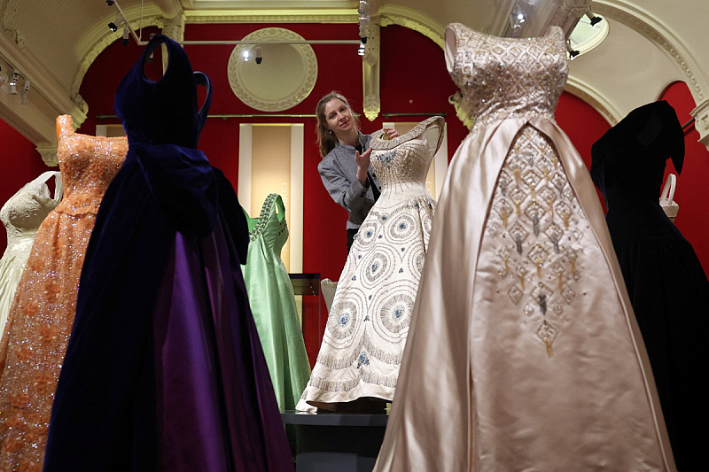 An exhibition honoring the 100th anniversary of Elizabeth II's birth offers a rare glimpse into the wardrobe of the late queen.