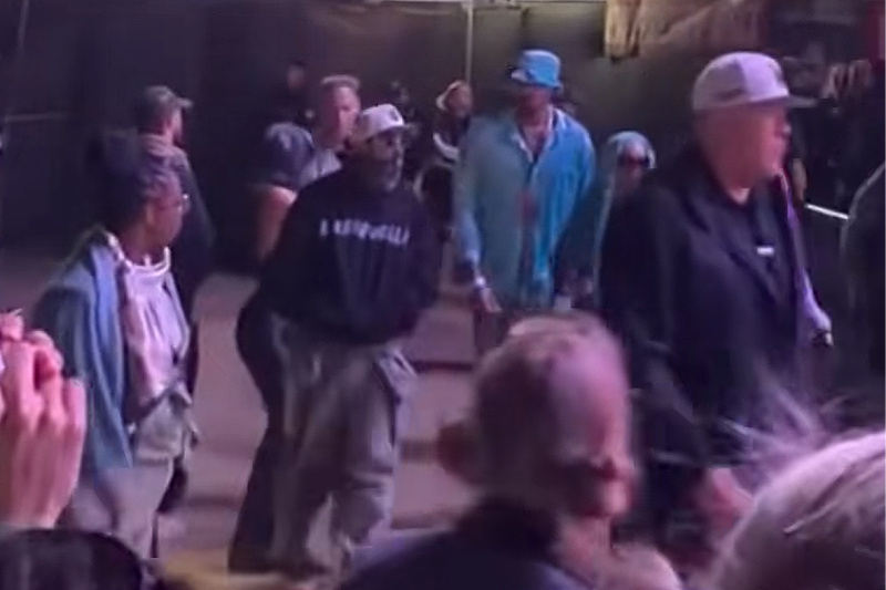 Kim Kardashian and Lewis Hamilton spotted at Coachella, disguised to avoid being seen.