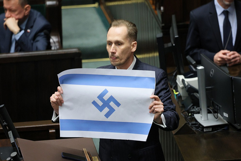 A member of the Polish parliament raised an Israeli flag with a swastika and said: "Israel is the new Third Reich."