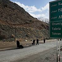 A twelve-hour drive through Iran reveals a different story: normal traffic, full restaurants, and "Western" music.
