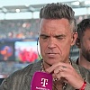 Šta je Robbieju Williamsu palo na mikrofon tokom TV javljanja: Pjevač se oglasio nakon viralnog snimka